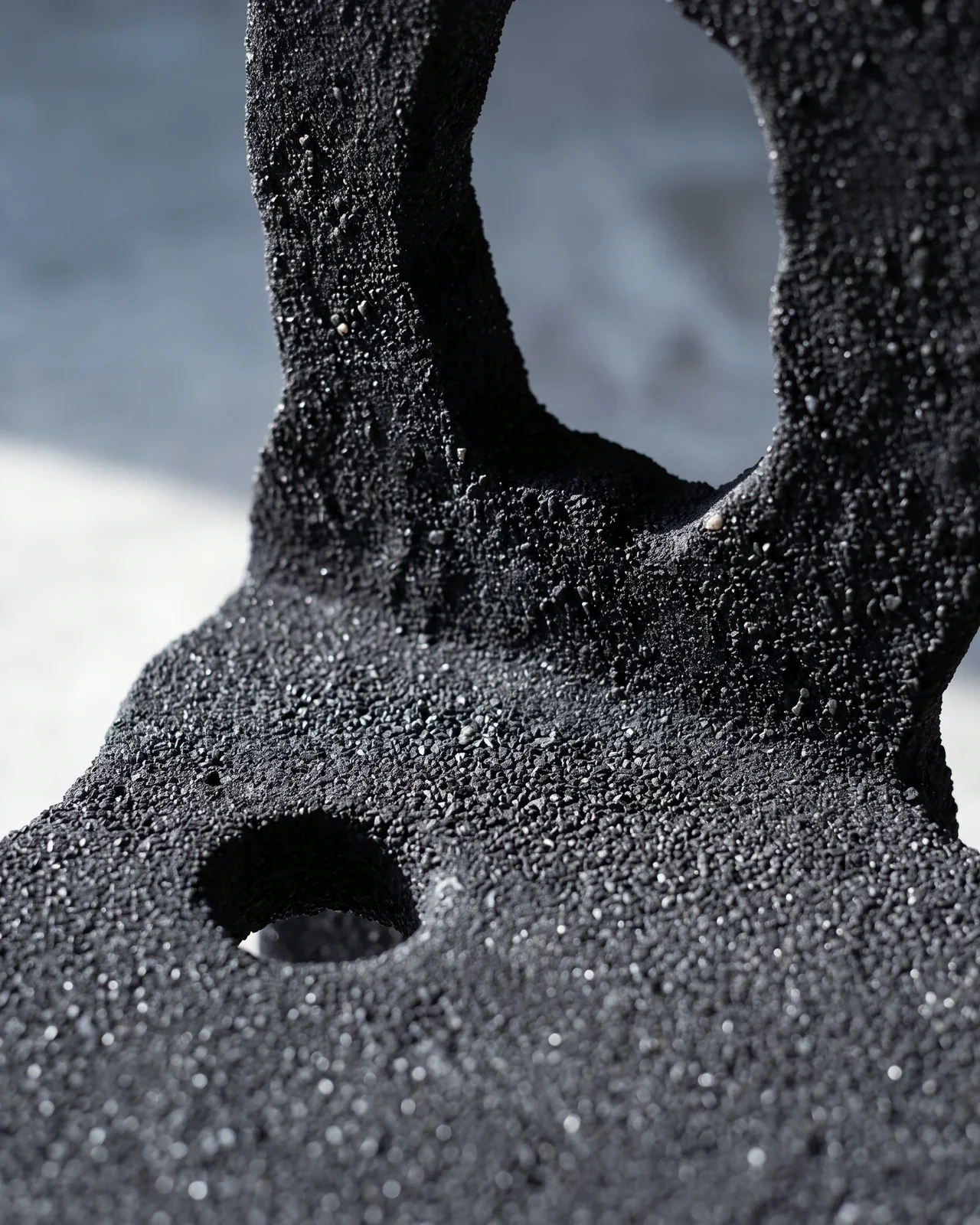 Close-up of the black sand grain where the backrest meets the seat, Aetna Chair, by Paul Hardy