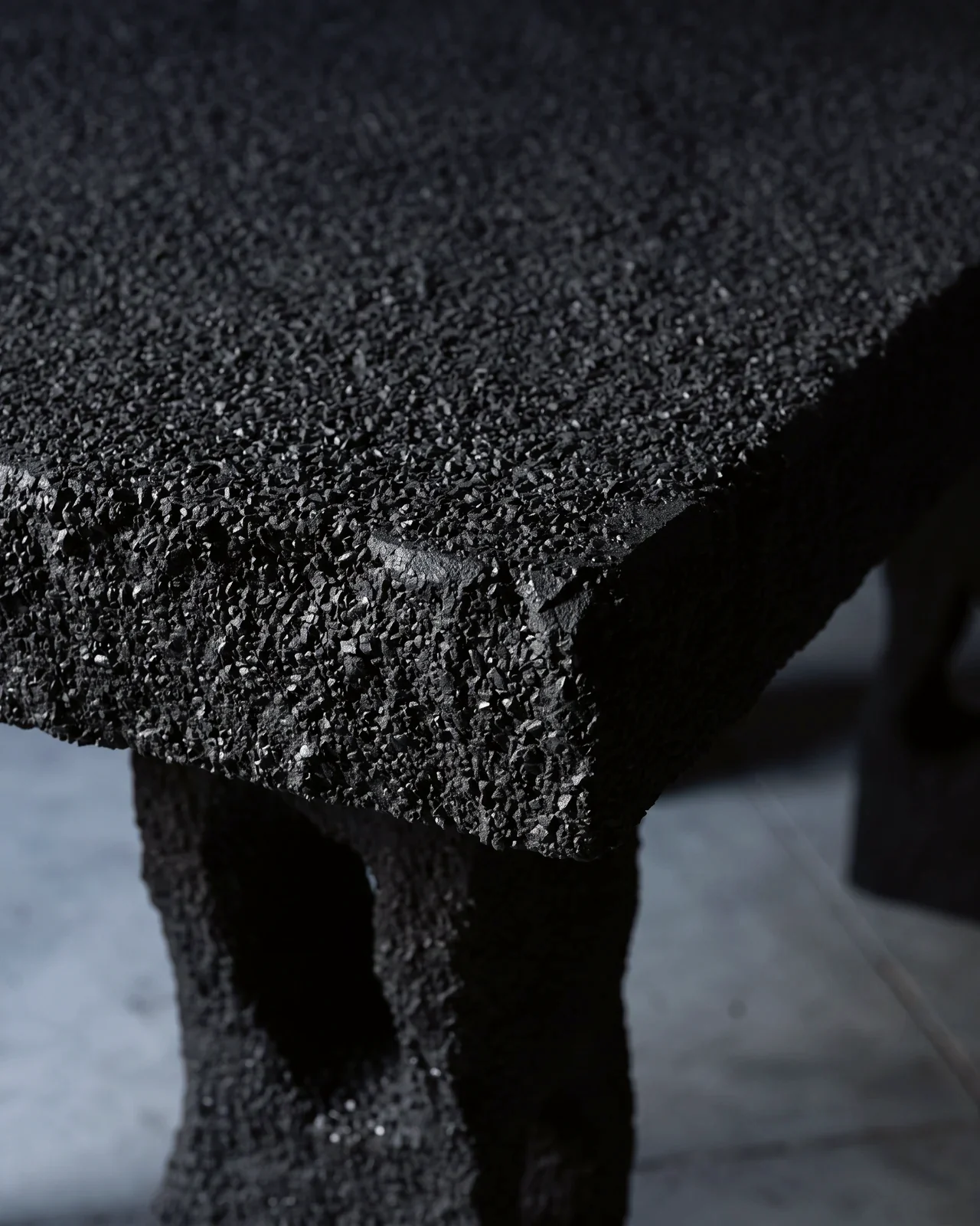 Corner of the tabletop, black sand and rubble grain, Aetna Table, by Paul Hardy