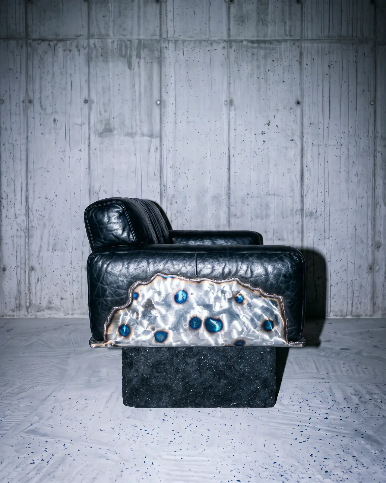 Ustio Sofa, side view with heat-tinted steel panel, by Paul Hardy